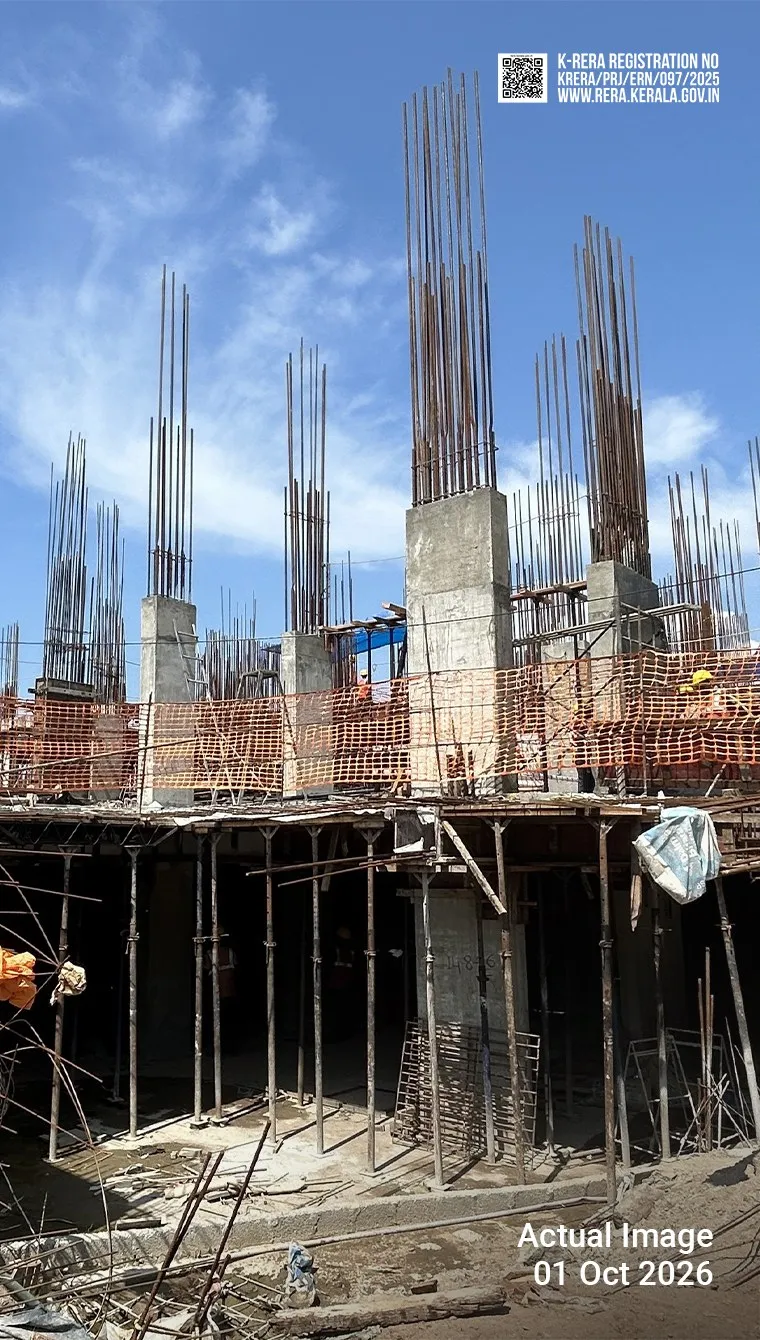 Flora construction site on 1 October 2026: reinforced concrete columns and steel bars rising against a blue sky